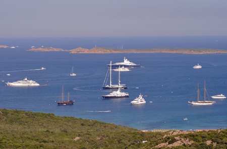 Panorama view of luxury yacths anchored in the wonderful scenery of Costa Smeralda - Sardinia - Italyの写真素材