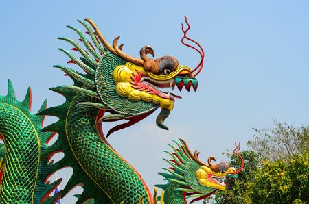 Dragon guard statue at the temple entrance in Suphan Buri,Thailandの写真素材