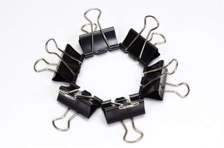 Black paper clip  isolated on white background.