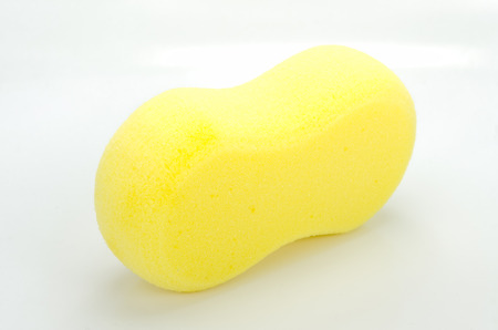 Yellow sponge for car washing  on white background.の写真素材