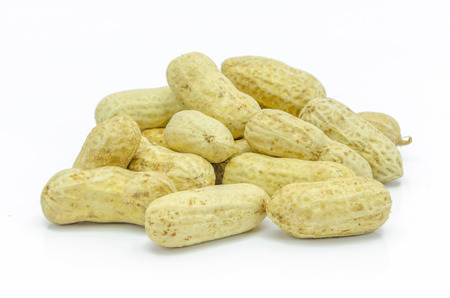 Dried peanuts  in closeup on white background.