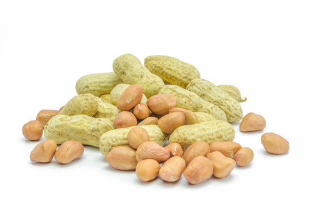 Dried peanuts  in closeup on white background.