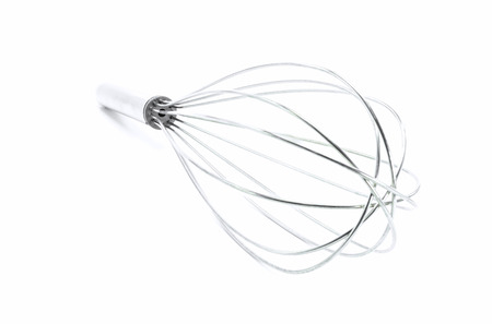 Stainless steel whisk isolated on white background.