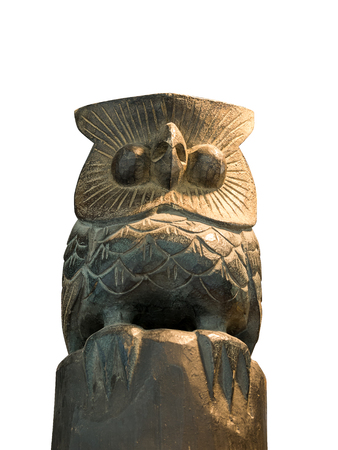 Statuette of a cute owl on a white background.の写真素材