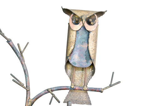 Statuette of a cute owl on a white background.の写真素材