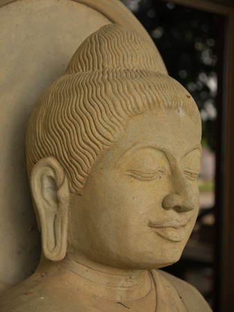 close up view of old concrete Buddha statue.の写真素材