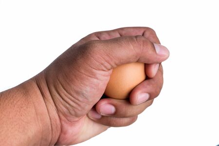 Fresh Eggs are holding by hand isolated in white background.の写真素材
