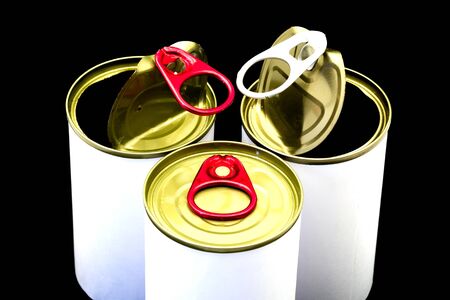 Empty opened tin can on black background.
