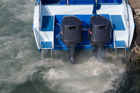 Boat engines tune up  rear view of speed boat running.の写真素材
