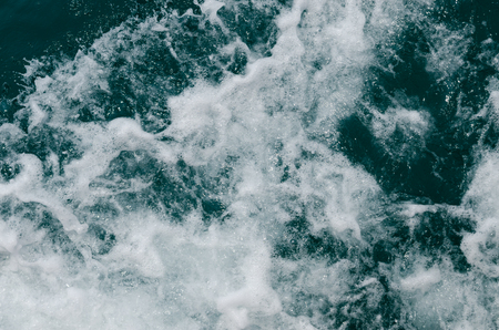 Close up blue water splash. water spray from the waves.の写真素材