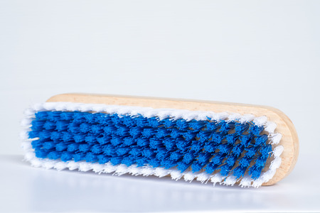Wood brush for cleaning house on white background.の写真素材