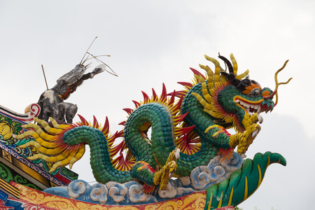 Golden dragon statue. Chinese dragon on the temple roof.の写真素材