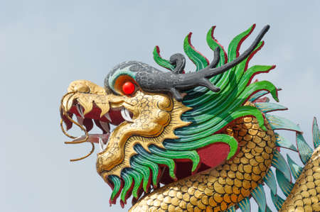 Golden dragon - Statue in a chinese temple in thailand.のeditorial素材