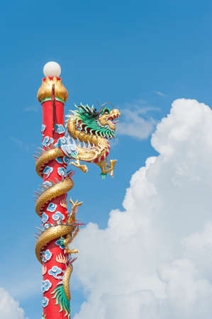 Golden dragon - Statue in a chinese temple in thailand.のeditorial素材