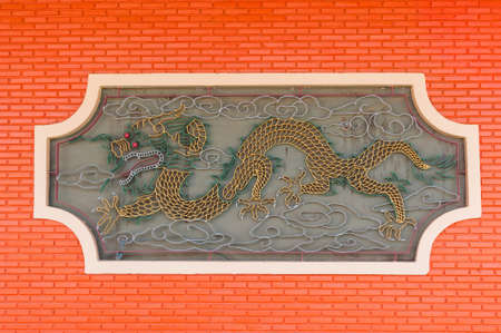 Golden dragon - Statue in a chinese temple in thailand.のeditorial素材