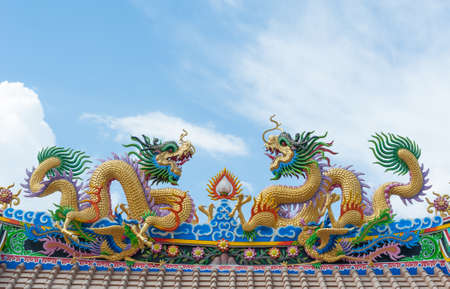 Golden dragon - Statue in a chinese temple in thailand.のeditorial素材