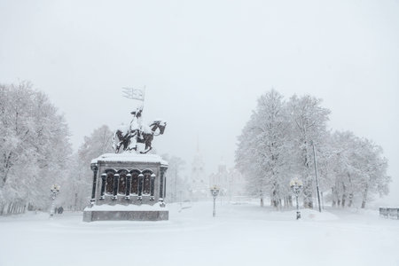 City after blizzard. View on the monument of prince Vladimir and Assumption Cathedralの写真素材