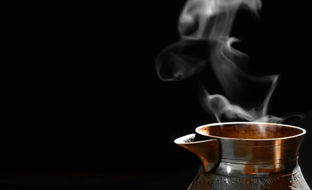 Barista prepares hot tasty drink from copper cezve. Organic copper coffee pot, Turk to kitchen. Copper cezve for real gourmet coffee in cezve.の写真素材