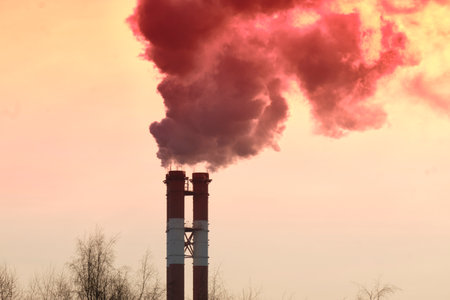Power plant with smoke and dirty red viva magenta air Concept air pollution, environmental problems,...