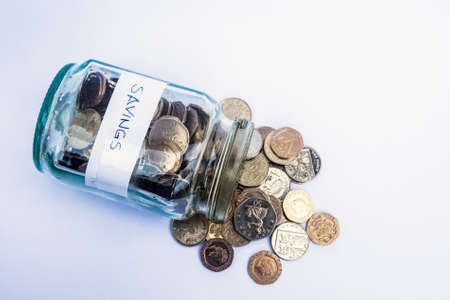 A "savings" jar for the proverbial rainy day.の写真素材