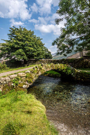 This ancient bridge is now where climbers and fell walkers meet to start the ascent on Scafell Pike,...