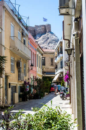 A typical street scene in Athens with the Greek flag in the distance.のeditorial素材