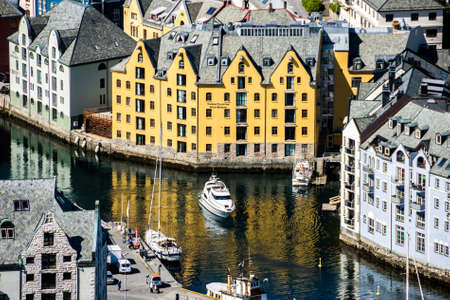 A boat on the waterway at Alesund, Norwayの写真素材