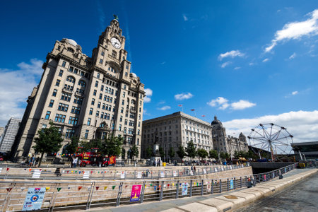 A dramatic view of the Royal Liver Building, Cunard Building and Port of Liverpool Building.のeditorial素材