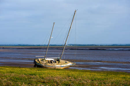A ketch lies wrecked on the beach at Lytham St. Annes, Lancashire, UK.