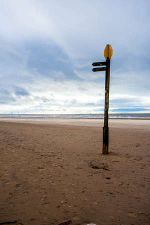 A signpost stands in the middle of nowhere.の写真素材