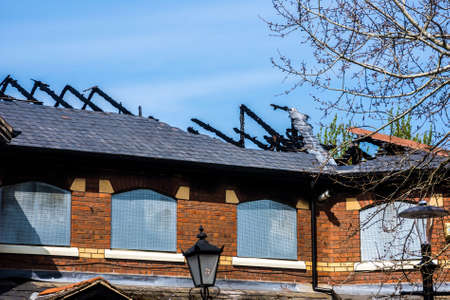 Fire damage to the roof of a disused pub at Preston Dock, Lancashire, UK.の写真素材
