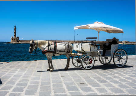 A horse and carriage is a typical tourist attraction in chania, Crete.の写真素材
