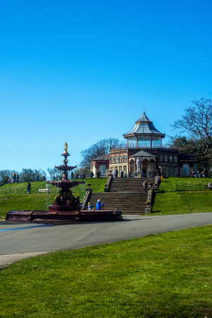 People enjoying spring sunshine at Mesnes (prononced Mains) Park, Wigan UK.のeditorial素材