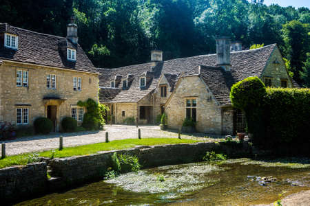 The Bybrook River meanders through the village of Castle Coombe.のeditorial素材