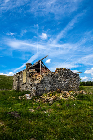 An old derelict house in remote countryside, near Ribblehead, Yorkshirer.の写真素材