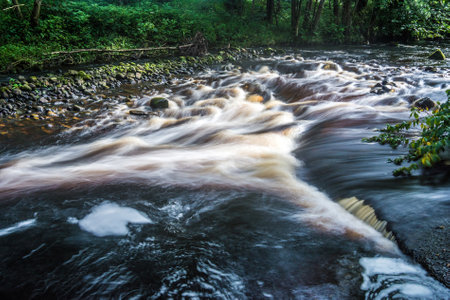 The fast flowing River Hodder at Dunsop Bridge.の写真素材