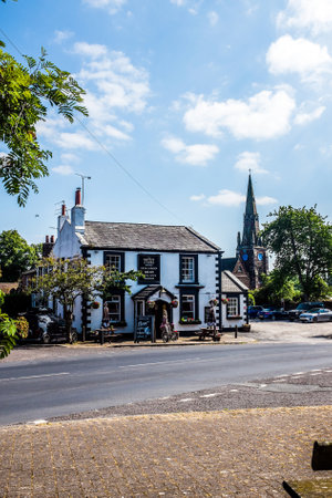 The village centre of Thornton Hough, with the Seven Stars pub in the foreground.の写真素材