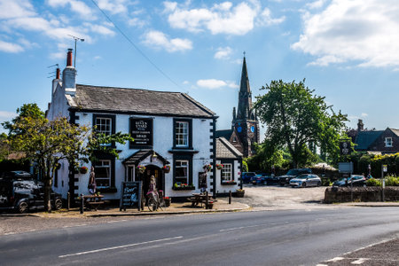 The village centre of Thornton Hough, with the Seven Stars pub in the foreground.の写真素材