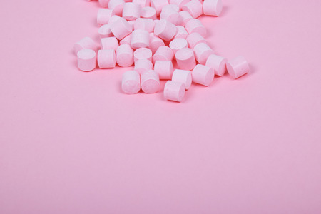 Pink Candy Lollies on a Pink Backgroundの写真素材