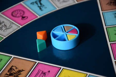 Colorful board game pieces in a pie wheelのeditorial素材