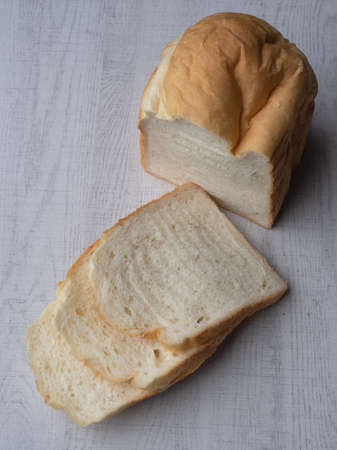 Homemade bread on white wood background