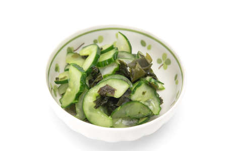 Japanese pickle with seaweed wakame in white ceramic bowl isolated on white background. Healthy food.の写真素材