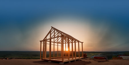 construction of a wooden frame house with a beautiful landscape at sunsetの素材