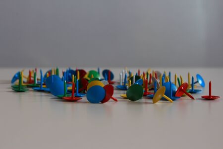 A mess of colorful tacks.