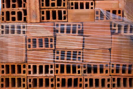 Pile of red clay bricks with stretchの写真素材
