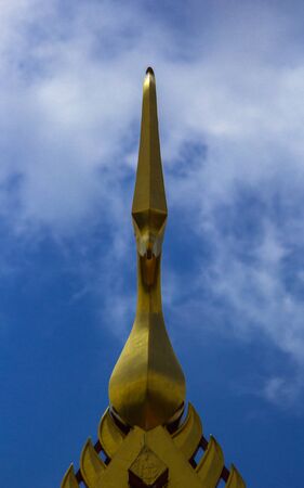 golden top gable on roof templeの写真素材
