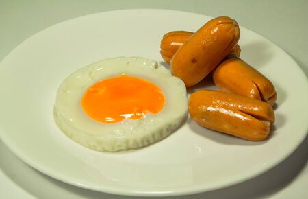 Fried egg and sausage is good breakfastの写真素材