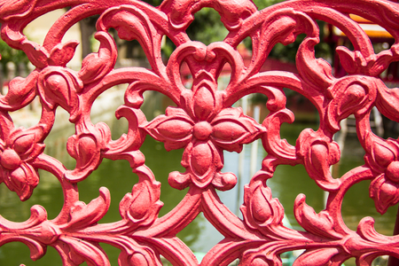 red cast iron on bridge railingの写真素材