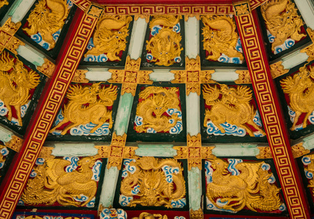 Golden dragon carved decorated on ceiling chinese pavilionのeditorial素材