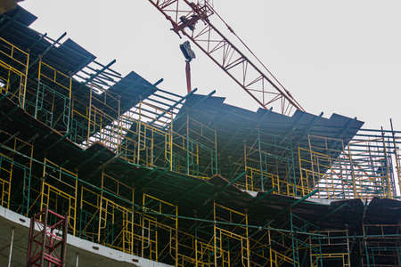 Construction scaffolding element. Blue sky background